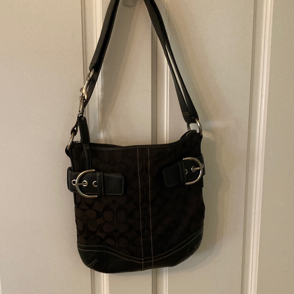 Authentic coach, leather backpack, space, elegant, pristine, and timeless